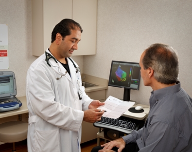 Cardiac electrophysiologist speaking with patient